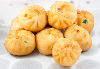 Dessert made of flour stuffed on oil clear sheet