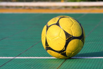 Soccer ball on special outdoor surface field.