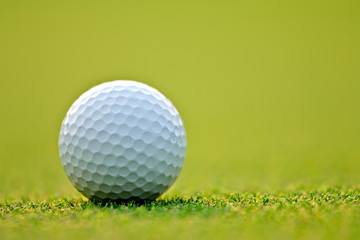 Golf ball on green grass