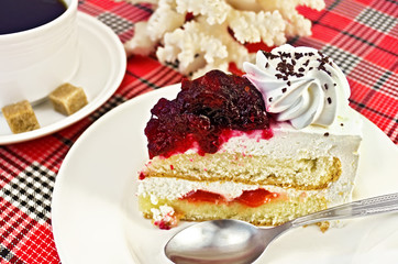 Cake in a plate with coffee and coral