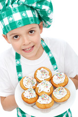 Little boy chef with muffins