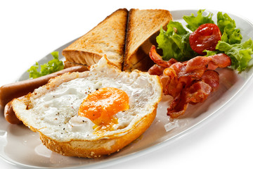 English breakfast - toast, egg, bacon and vegetables