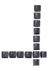 Obraz premium Keyboard keys saying internet-hacker isolated on white