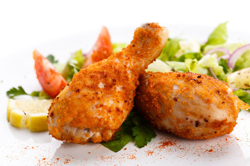 Roasted chicken drumsticks and vegetables