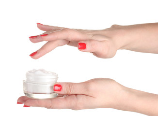 Female hands with manicure holding cream isolated on white