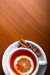 cup of hot tea on wooden background