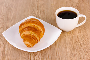 Classical breakfast. Coffee and croissant