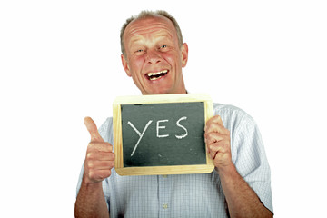 Positive man showing thumbs up with sign '' yes''