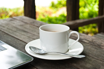 Coffee cup and laptop for business.