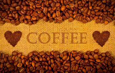 Coffee grains on the burlap background