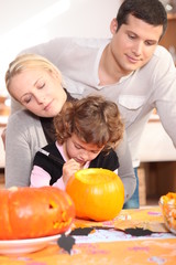 Fototapeta na wymiar Family carving pumpkin