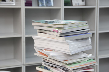 A stack of books and shelves.