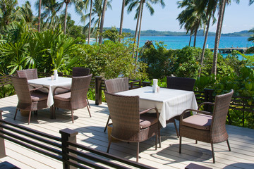 Table and chairs with a beautiful sea view . Thailand .