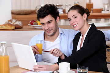 A modern couple having breakfast.