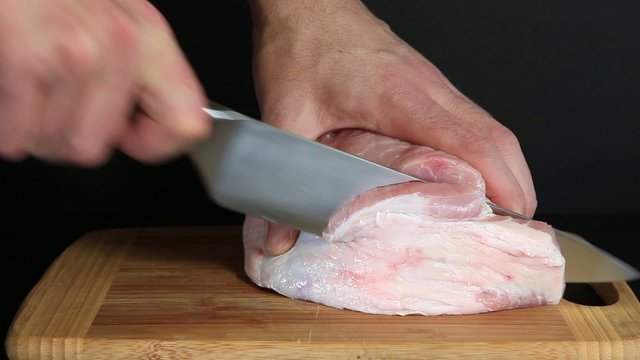 Cutting pork meat
