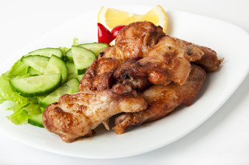 Grilled chicken on a white plate