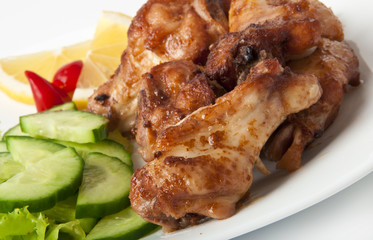 Grilled chicken on a white plate