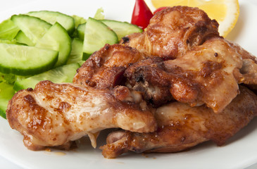 Grilled chicken on a white plate