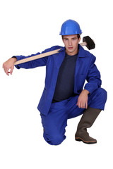 Young construction worker on white background