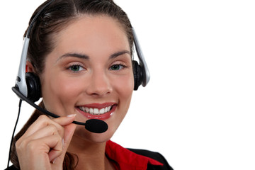 A businesswoman with a headset on.