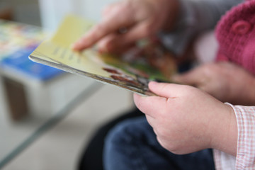 Grandparent reading with granddaughter