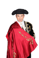 Man in a matador costume with a red cape - obrazy, fototapety, plakaty