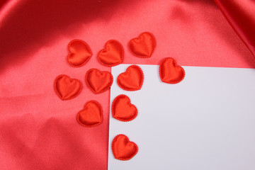 White card for congratulation on red silk background