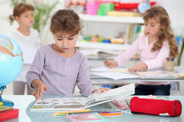 little girls studying in a classroom