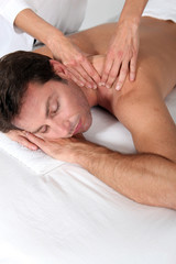 Obraz na płótnie Canvas Man enjoying back massage