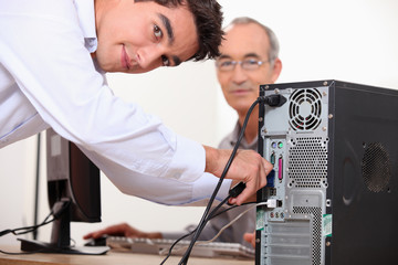 Computer technician repairing PC