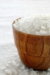 sea salt in wooden bowl on a towel