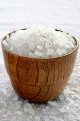 sea â€‹â€‹salt in wooden bowl on a towel