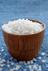 sea salt in wooden bowl on a towel