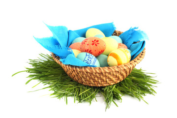 Basket of easter eggs on white