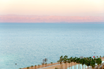 early pink sunrise on Dead Sea coast