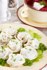 Traditional Russian cuisine. Pelmeni and borscht