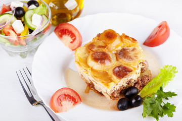 Greek cuisine. Moussaka and greek salad