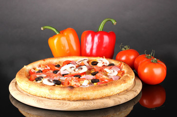 Aromatic pizza with vegetables isolated on black
