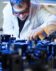 scientist doing research in a quantum optics  lab (shallow DOF;