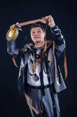 Man in a suit with the cine-film