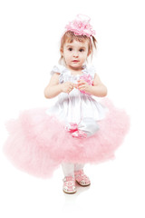Portrait of a young girl in beautiful pink dress