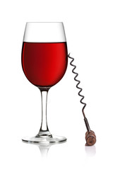 Glass of red wine and corkscrew on a white background