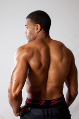 Fototapeta premium strong man toopless, showing his back
