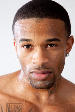 strong man toopless, looking thoughtful