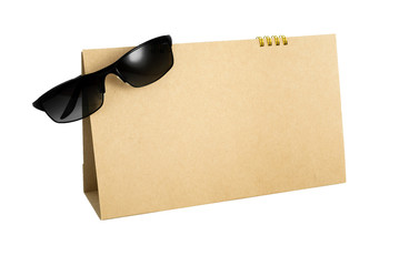 blank calendar with sun glass