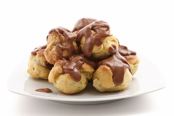 Naklejka premium plate with profiteroles