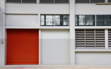 structure of orange metal door on the white wall