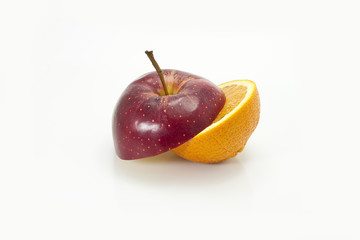 Apple cut on half with orange