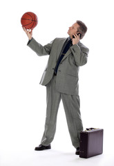 Business Man Holding a Basket Ball and Cell Phone