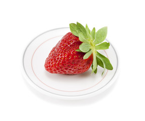 Strawberries on a plate on white isolated background